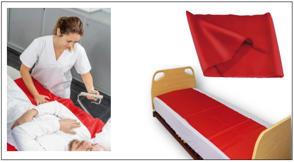 Sábana deslizante roja usada para movilizar a un paciente encamado y colocada sobre una cama articulada